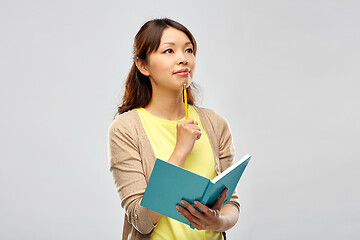 Image showing asian student woman with diary and pencil