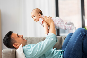 Image showing happy middle aged father with baby at home