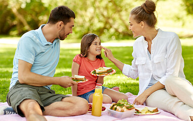 Image showing happy family having picnic at summer park