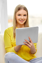 Image showing young woman or teenage girl with tablet pc at home