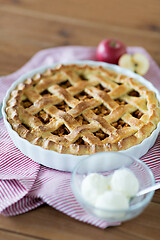 Image showing apple pie with ice cream on wooden table