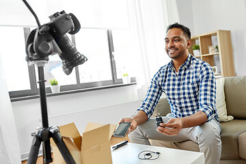 Image showing male blogger with smartphone videoblogging