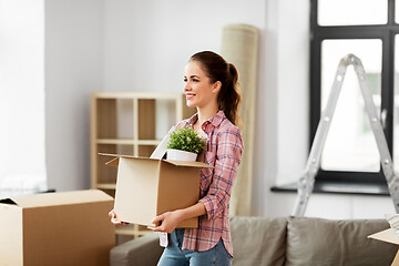 Image showing happy woman with stuff moving to new home