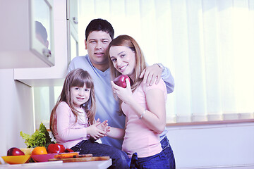 Image showing happy young family in kitchen