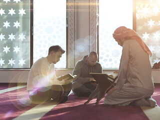 Image showing muslim people in mosque reading quran together