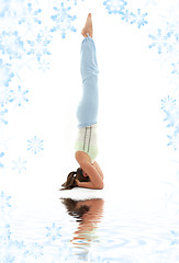 Image showing salamba sirsasana supported headstand on white sand