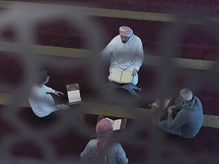 Image showing top view of muslim people in mosque reading quran together