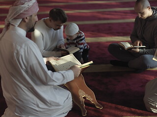 Image showing muslim people in mosque reading quran together