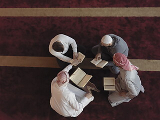 Image showing top view of muslim people in mosque reading quran together