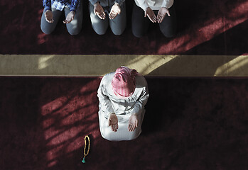 Image showing muslim people praying in mosque  top view