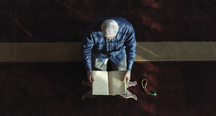 Image showing muslim man praying inside the mosque top view