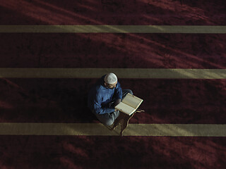 Image showing muslim man praying inside the mosque top view