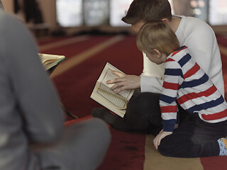 Image showing muslim people in mosque reading quran together