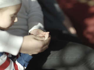 Image showing father and son in mosque praying and reading holly book quran to