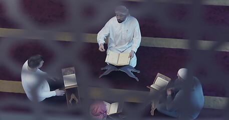 Image showing top view of muslim people in mosque reading quran together