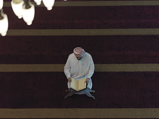 Image showing muslim man praying inside the mosque top view