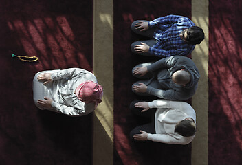 Image showing muslim people praying in mosque  top view