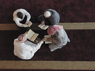 Image showing top view of muslim people in mosque reading quran together