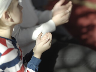 Image showing father and son in mosque praying