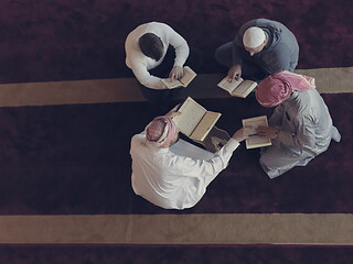 Image showing top view of muslim people in mosque reading quran together