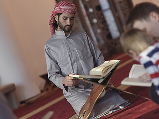 Image showing muslim people in mosque reading quran together