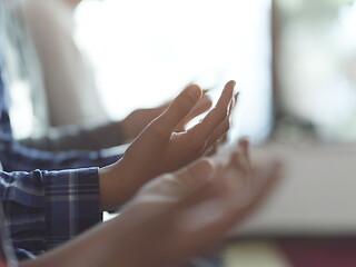 Image showing muslim people praying in mosque closeup on hands