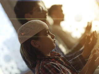 Image showing father and son in mosque praying