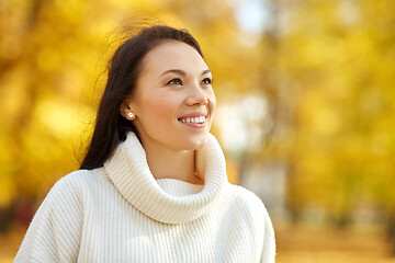 Image showing portrait of happy young woman in autumn park