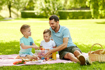 Image showing happy family having picnic at summer park