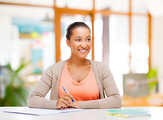 Image showing african american female student with notebook