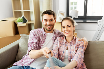 Image showing couple taking selfie while moving to new home