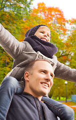 Image showing happy family having fun in autumn park