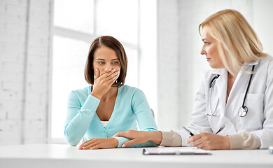 Image showing doctor and sad woman patient at hospital