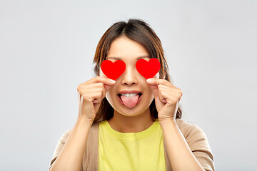 Image showing happy woman with eyes of hearts