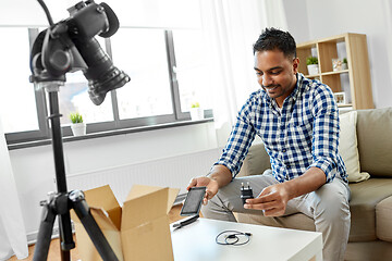 Image showing male blogger with smartphone videoblogging