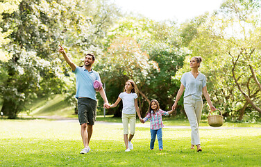 Image showing family with picnic basket walking in summer park