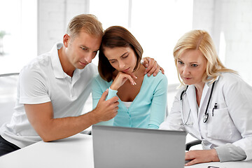 Image showing sad couple and doctor at family planning clinic