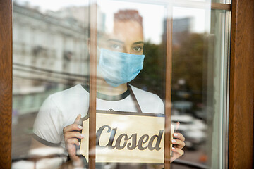 Image showing Closed sign on the glass of street cafe or restaurant