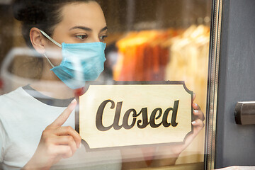 Image showing Closed sign on the glass of street cafe or restaurant