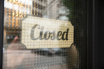 Image showing Closed sign on the glass of street cafe or restaurant