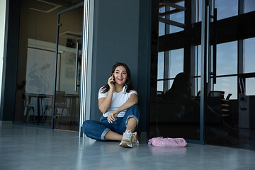 Image showing Young woman waiting for departure in airport, traveler with small baggage, influencer\'s lifestyle