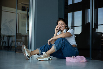 Image showing Young woman waiting for departure in airport, traveler with small baggage, influencer\'s lifestyle