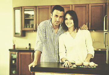 Image showing happy young couple have fun in modern kitchen