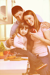 Image showing happy young family in kitchen