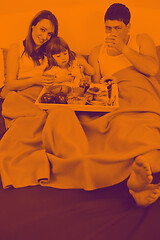 Image showing happy young family eat breakfast in bed