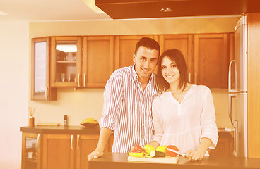 Image showing happy young couple have fun in modern kitchen