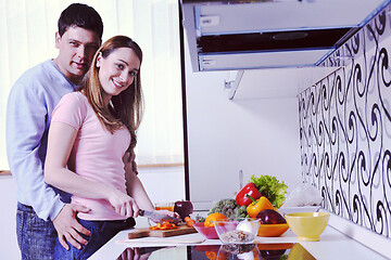 Image showing couple have fun and preparing healthy food in kitchen