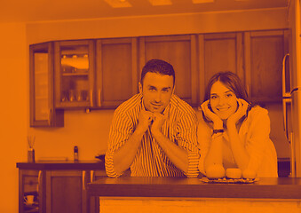 Image showing happy young couple have fun in modern kitchen