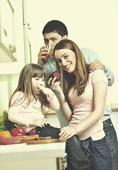 Image showing happy young family in kitchen