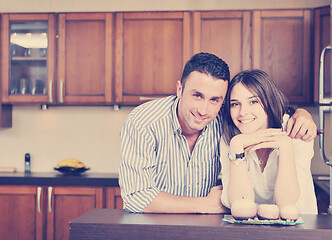 Image showing happy young couple have fun in modern kitchen